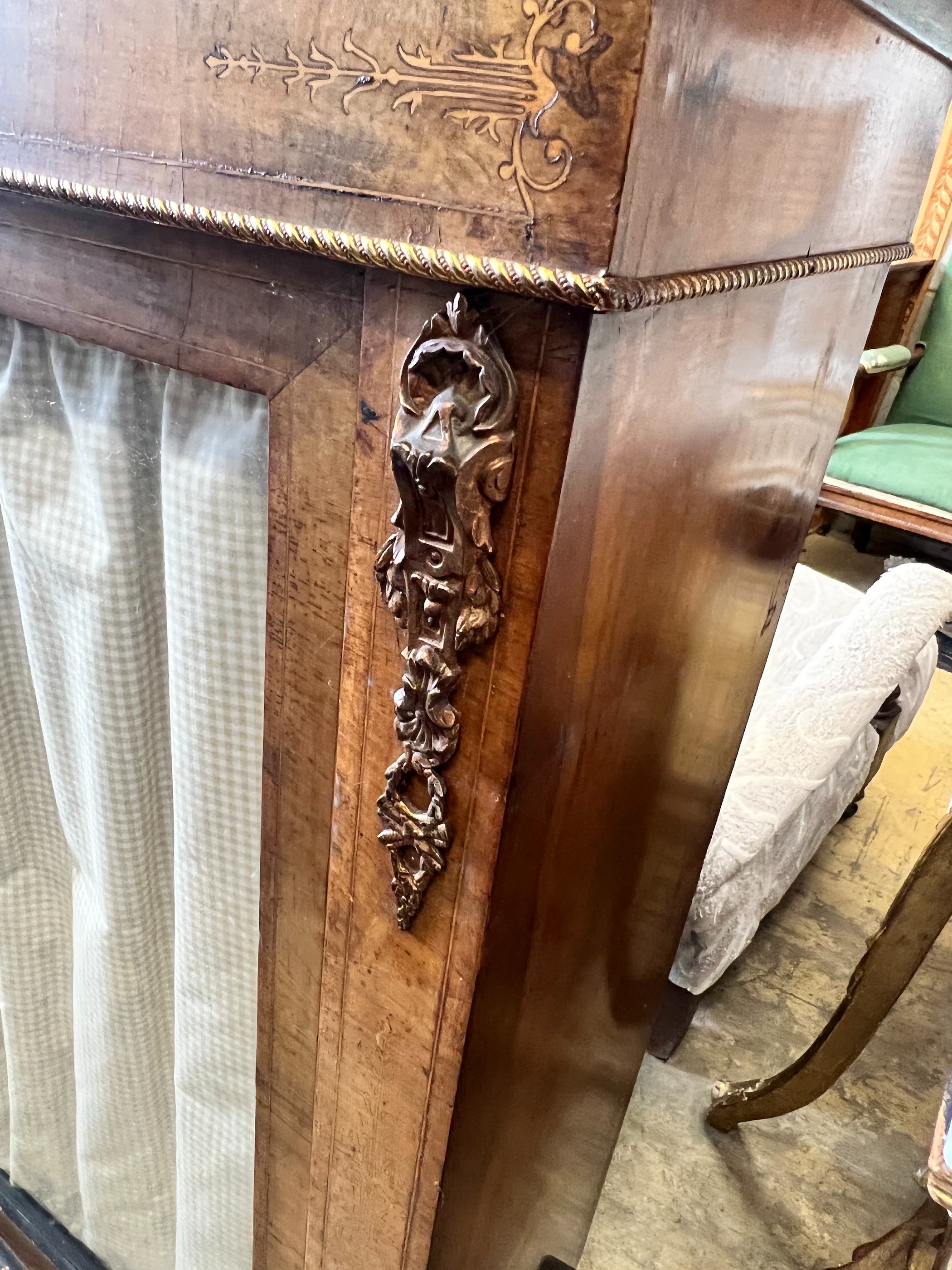 A Victorian gilt metal mounted inlaid walnut two door pier cabinet, width 121cm, depth 32cm, height 105cm